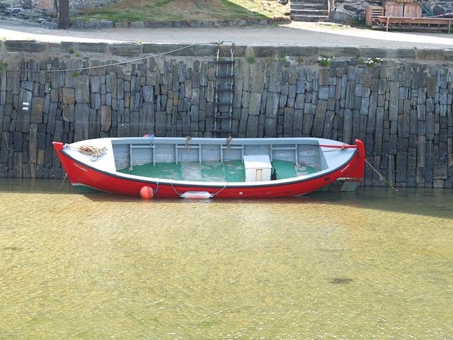 Red Rowing Boat in Harbour by Alison Gracie