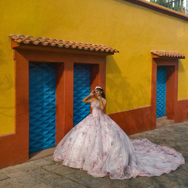 posing in her large gown,