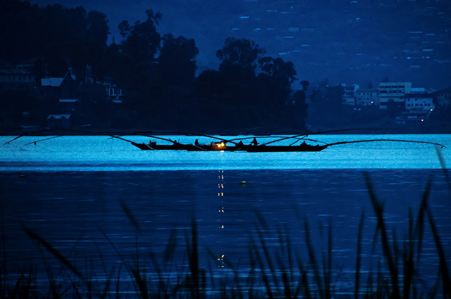 Fishermen at dusk on the Kivu lake in Bukavu