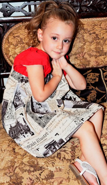 BRAELYN  MODELS A DRESS THAT COULD BE MADE FROM THE FRENCH NEWSPAPER.