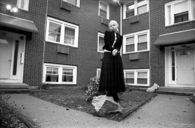 Victoria, in front of her building of residence.