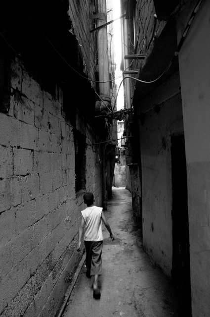Palestinian boy in alley in Chatila camp