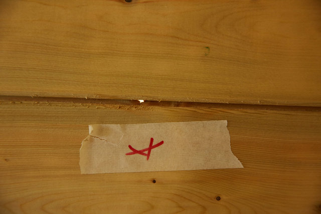 One of several holes in walls of shed.