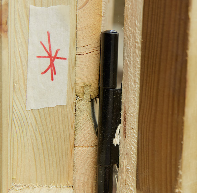 Cracks in the wood where the hinges have been screwed in - shown to inspector on April 24th