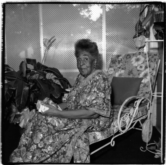 Mama and gift on front porch.jpg