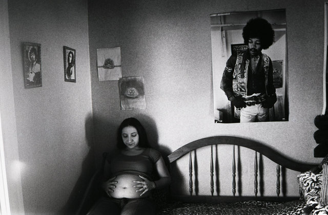 Irina, seven months pregnant in the room where she grew up.