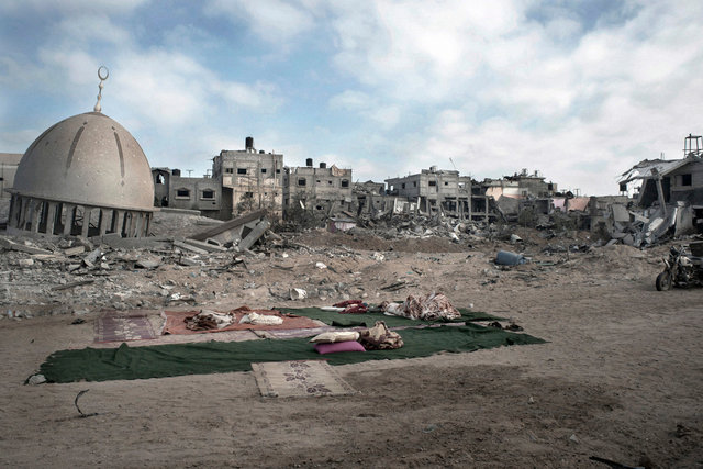 A child sleeping in the middle of a big area destroyed by israeli airstrikes Kuzaa, Gaza Strip