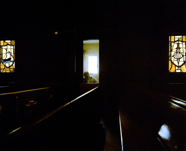 Priest in confessional, San Francisco