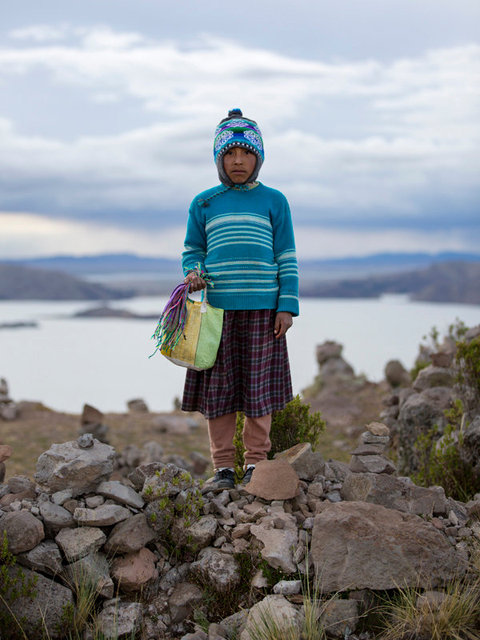 young boy selling bracelets