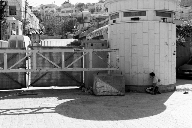 Boy hiding at checkpoint