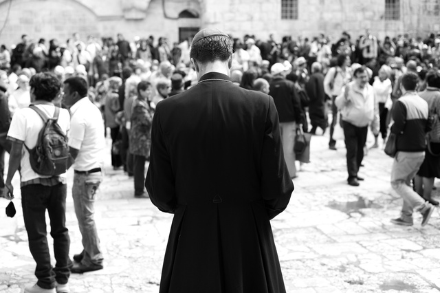 A catholic priest reflecting