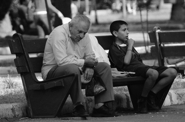 Old and young in a park