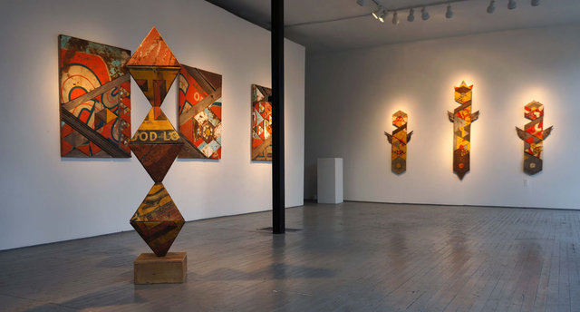 All of the works are constructed from reclaimed lumber and vintage metal advertising signage.