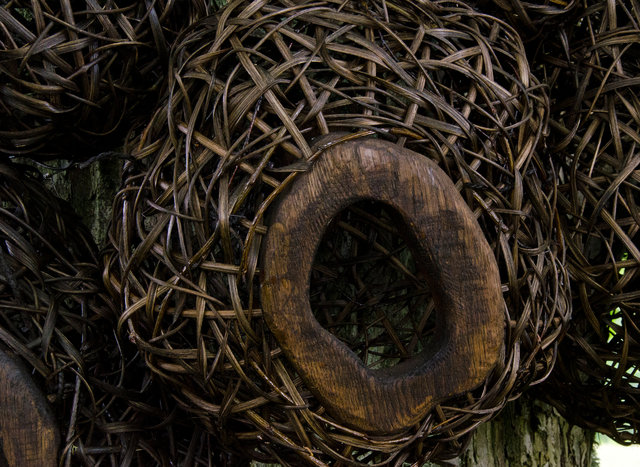 Installation from wood and rattan on the trees of the alley in Nääs, Sweden. 2015