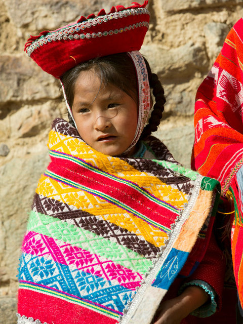 a sister and her brother sing for tourists outside of the ruins