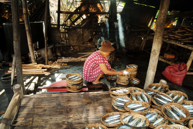 Villager Drying Fish