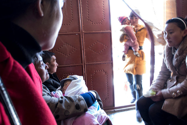 Patients inside a traditional pharmacy, Dali, Yunnan