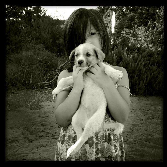 A girl with a dog, Puglia, Italy