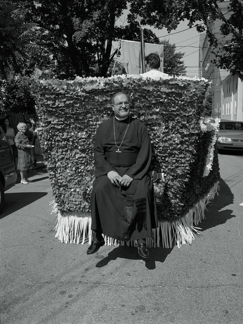 Priest on float at Cosmos & Dimiam Feast  Cambridge #56 Sept 9, 2001.jpg