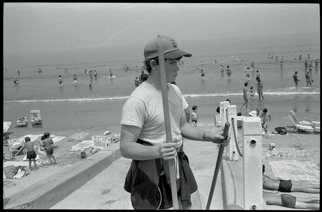 Boy with baseball cap & broom Beach.jpg