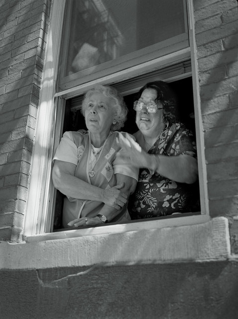 2 Women in window at St Anthony Feast #12 Aug 25, 2001.jpg