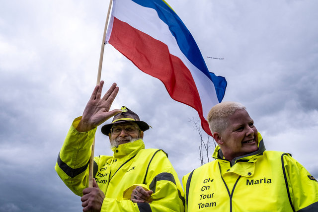 Protesters during Corona pandemic with inverted Dutch flag as a symbol of potest