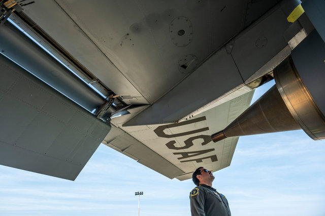 Captain Alexander Pacheco, 351st Air Refueling Squadron, Chief of Wing Current Operations inspects the aircraft