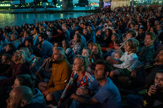 Public sits on the beach ready for big fireworks during Four Days Marches: The Waal in flames