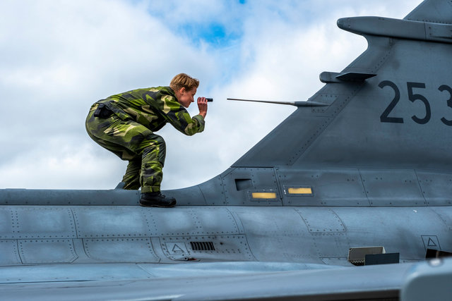 Military woman checks fighter jet at the international  NATO exercise Ramstein Flag in Leeuwarden 