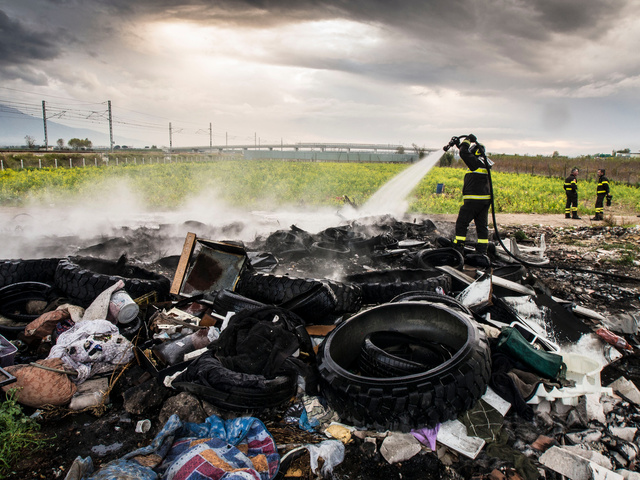 29.Piles of burnt truck tires.