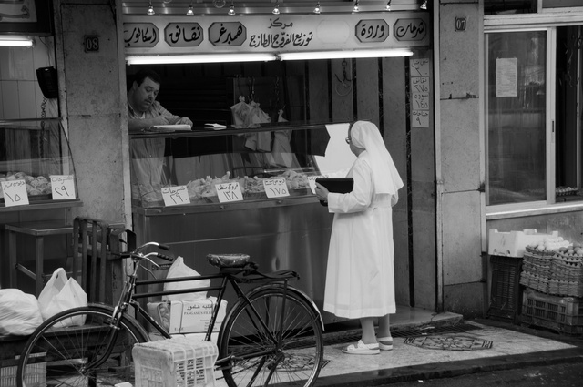 A Christian nun at the shop in Damascus