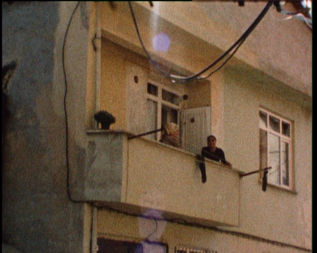 Passer-by: Between Azure, Bisque and Teal, super 8mm film transferred to 16mm film, 20 minutes film projection on loop, colour, optical sound, 2008