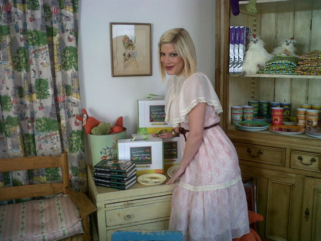 Tori Spelling's store InvenTORI, posing next to Mi