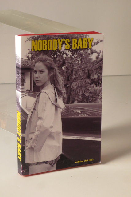 Nobody's Baby_Katrina del Mar_4.5x6x.75in handmade book_2013 45a_Katrina del Mar_Nobodys Baby_backview_4.5x6x.75in handmade paperback book_2013_Katrina del Mar paperbacks (selection of four hand made one of a kind paperback books in a case)