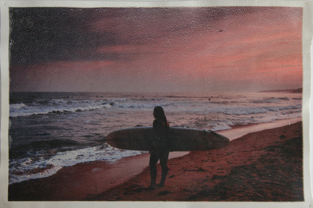 Katrina del Mar Surfergirl watching surfers Ditch Plains Twilight  archival pigment print on white leather 12 x 18 in.