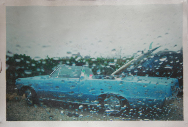Katrina del Mar: Blue Cadillac at Ditch Plains lot 12x18” archival pigment print on white leather