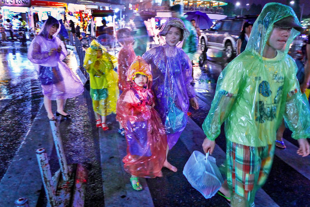 Hanoi family....keeping dry!