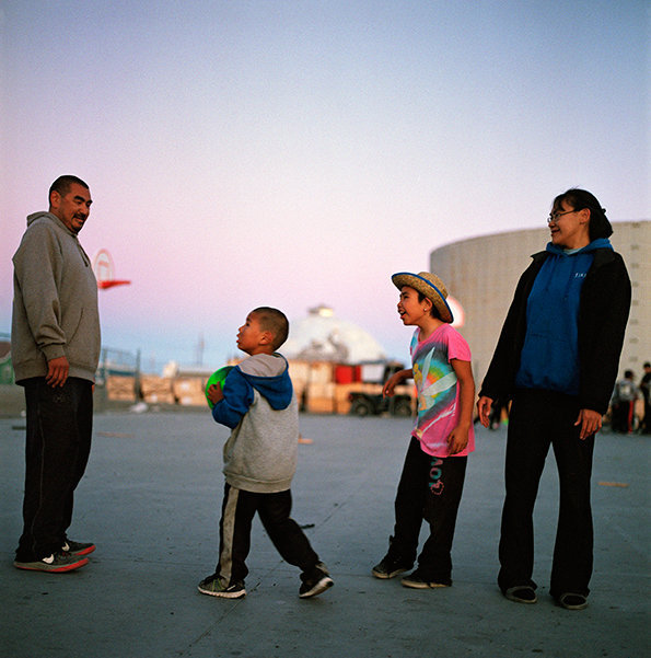 Andrew and Melissa playing basketball with their kids, August 2016