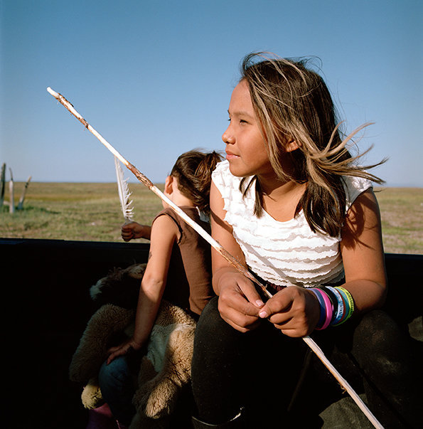 Josie and Anna Kupaaq in the pick-up bed on a drive out, July 2014