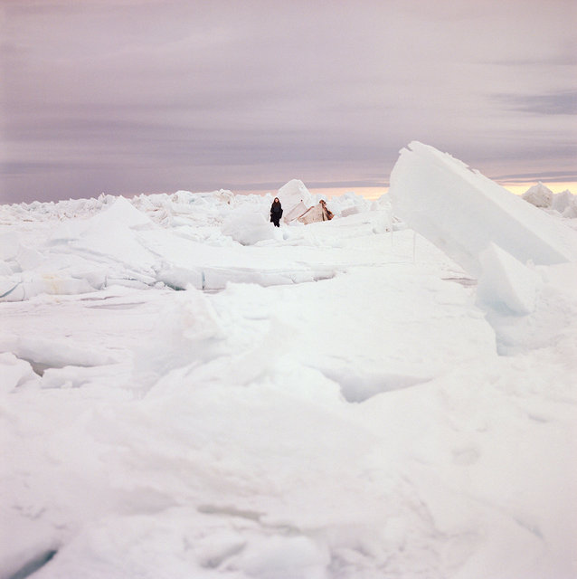 Nichole dwarfed by jagged ice, 2017