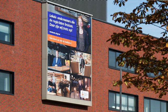 Portretserie lokale ondernemers op gevel Rabobank Breda