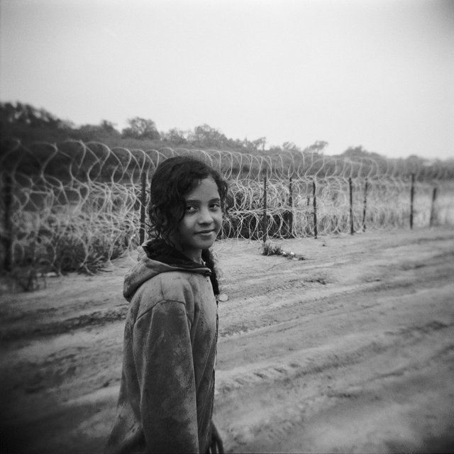 14-EAGLE PASS, TX, GIRL FROM ECUADOR WITH HER FAMILY WALKING THE LAST MILES TO BORDER PATROL STATION__11:2023.jpg