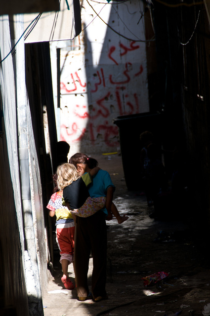 A child carrying a child in Chatila