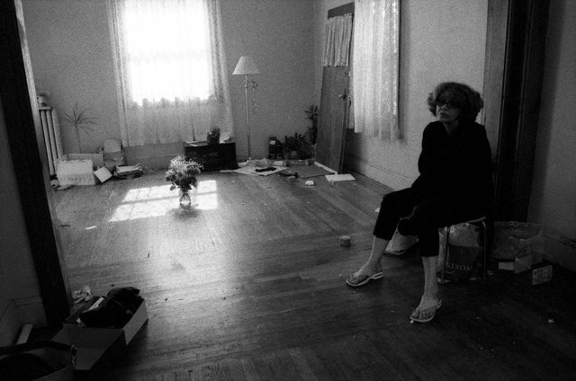 My mother in the living room, during a move to Houston.