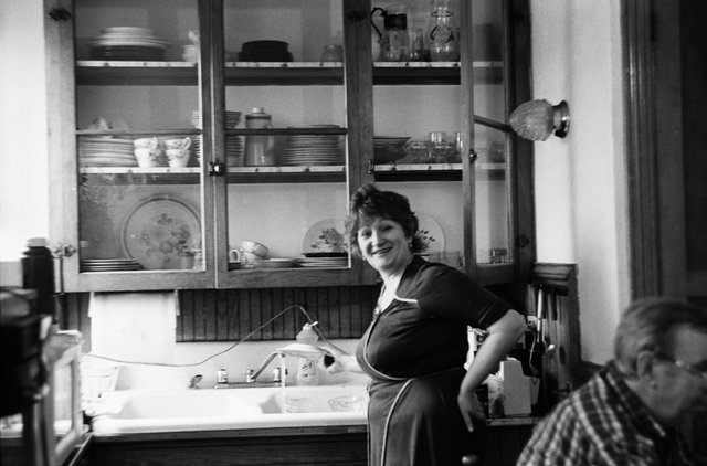 My aunt in the kitchen of her family's first apartment in America.