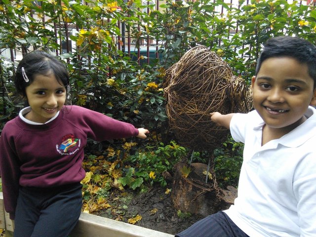 year 6 helping place the birds in the playground