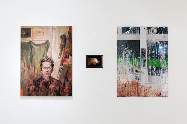 installation view: Wandzel portrait of Kuehl (left) from reflection of studio mirror (right)