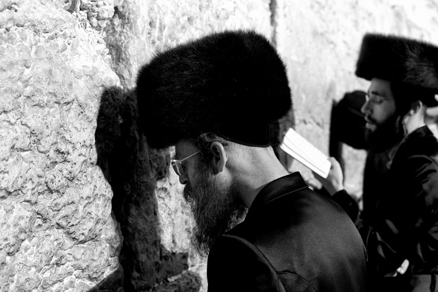 Men praying at the Wailing wall