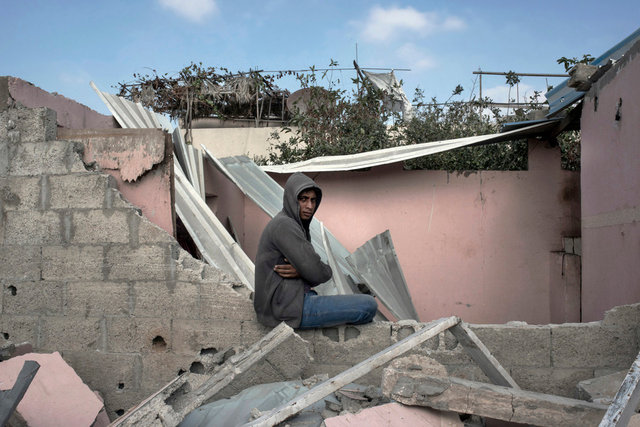 Resident returned to his destroyed house in a bedouin village, Al-qaria Al-Badawia, Gaza Strip