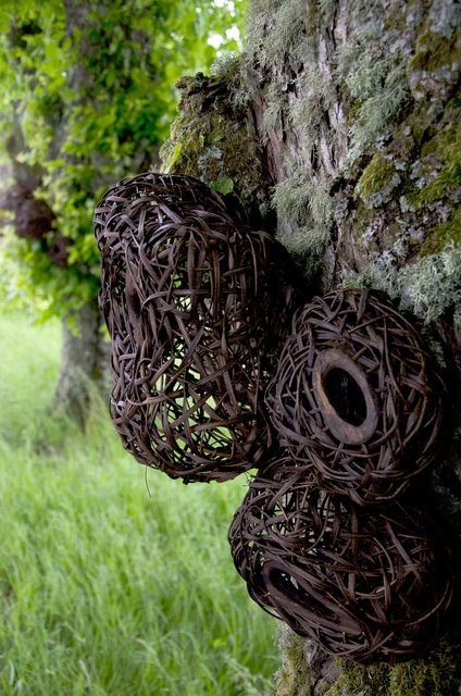 Installation from wood and rattan on the trees of the alley in Nääs, Sweden. 2015